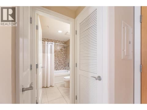 Bathroom and adjacent hallway in Unit 209. at 15 PARK Place Unit# 209, Osoyoos