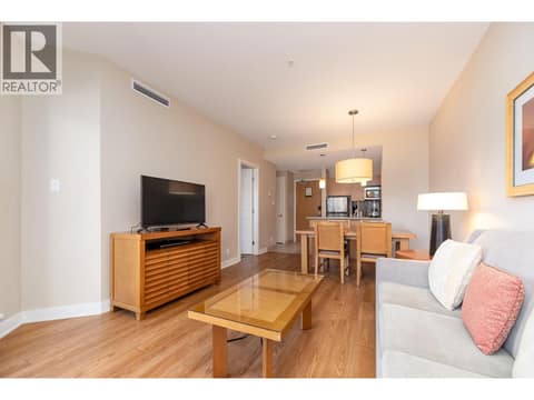 Furnished living room looking back toward the dining area and kitchen. at 15 PARK Place Unit# 209, Osoyoos