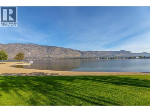 Landscaped lawn and beach along the Osoyoos Lake shoreline. at 15 PARK Place Unit# 209, Osoyoos