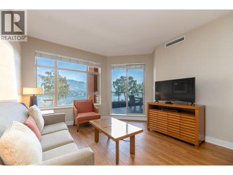 Living room with television area and direct access to the covered balcony. at 15 PARK Place Unit# 209, Osoyoos