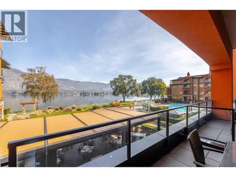 View from Unit 209’s covered balcony toward Osoyoos Lake and the resort grounds. at 15 PARK Place Unit# 209, Osoyoos
