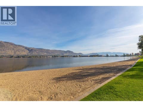 Waterfront beach with Osoyoos Lake and mountain views. at 15 PARK Place Unit# 209, Osoyoos