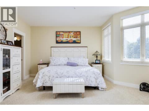 Primary Bedroom ~ with WIC, ensuite & access to covered deck at 4205 Gellatly Road Unit# 231, Westbank Centre, West Kelowna