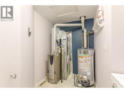 Closer view of the mechanical equipment within the utility room. at 145 REDWING Place Unit# 7, Oliver