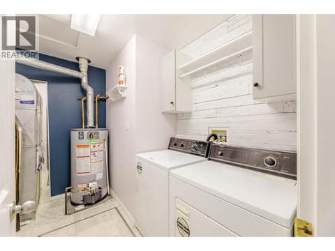 Dedicated utility room contains side-by-side laundry and mechanical equipment. at 145 REDWING Place Unit# 7, Oliver