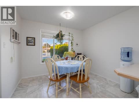 Windowed dining area positioned beside the kitchen. at 145 REDWING Place Unit# 7, Oliver